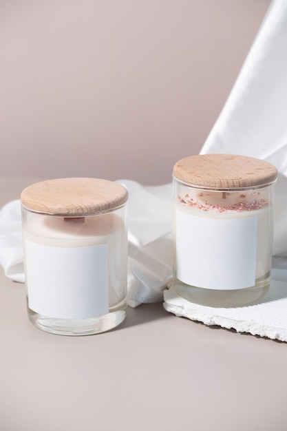 Photo candle in a jar with a white label with a wooden lid