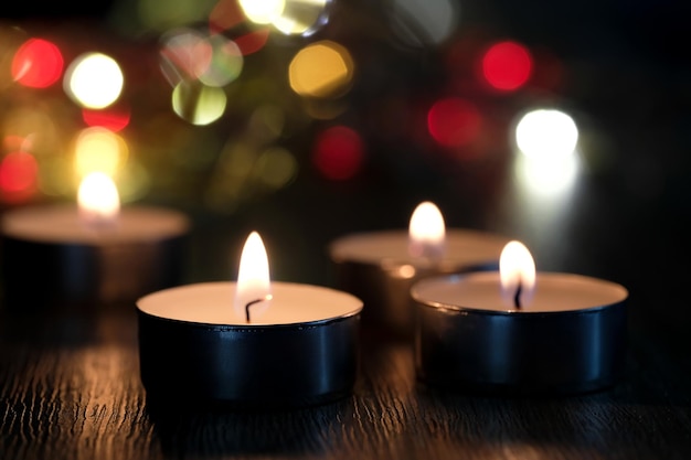 Candle light and bokeh background in the darkness with space for text or image