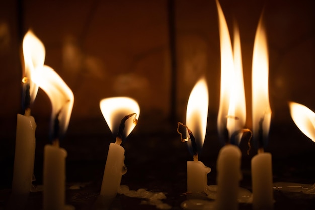 Photo candle lights in the darkness abstract candles background hope fire
