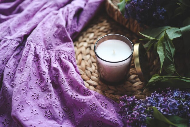 Candle and lilac in home interior