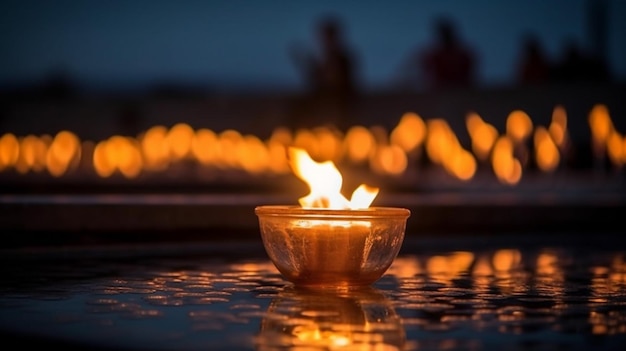 A candle lit in front of a fire pit