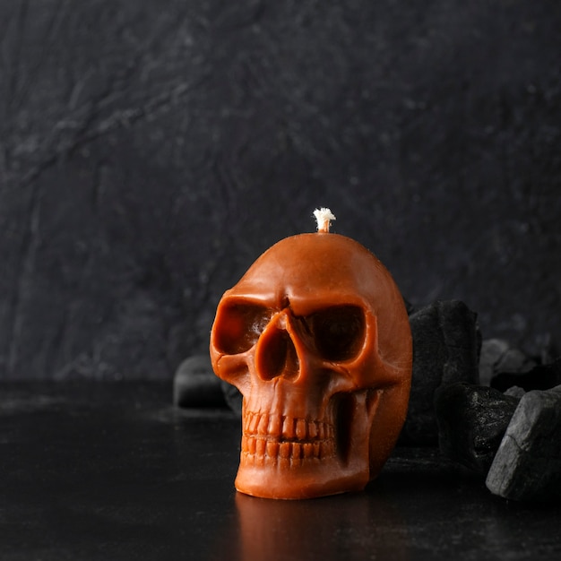 Candle skull on a black background.