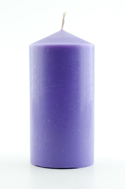 Candle tied with rope on white background