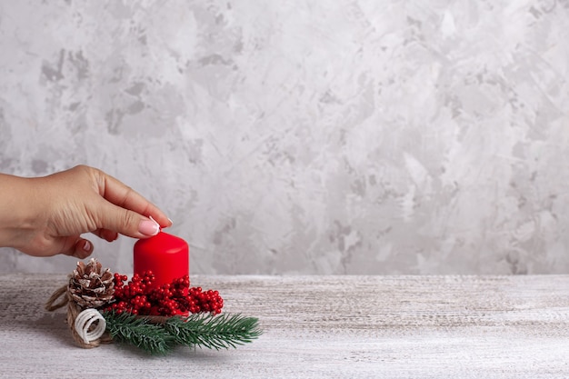 Candle with decorations on a wooden table