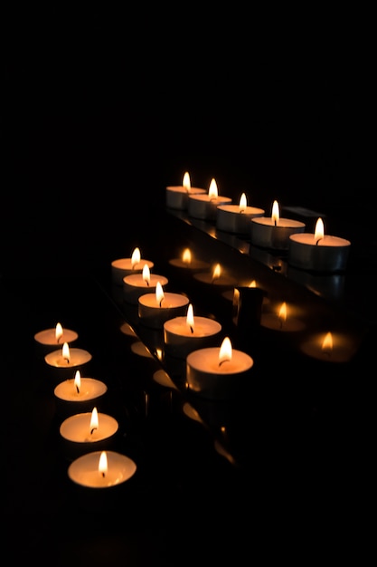 Candles at the alter lighting up the darkness