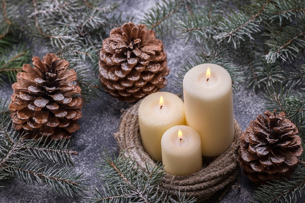 Candles and two glasses of wine in New Year decorations