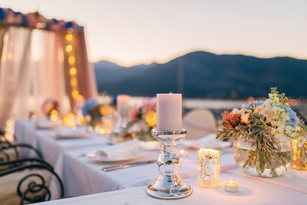 Candles on the wedding table at a banquet