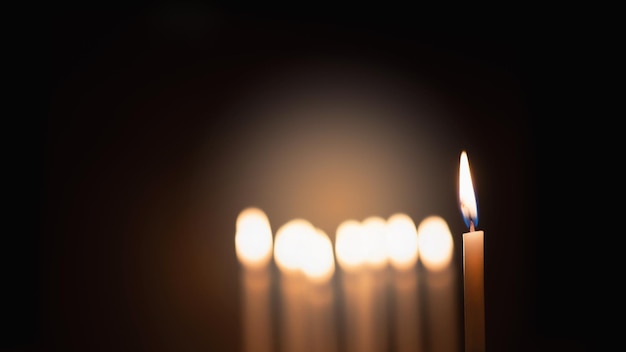 Candles were lit in the darkness to perform some rituals such\
as orange light and focus on some candles to make them stand out\
some are out of focus for depth of field and bokeh