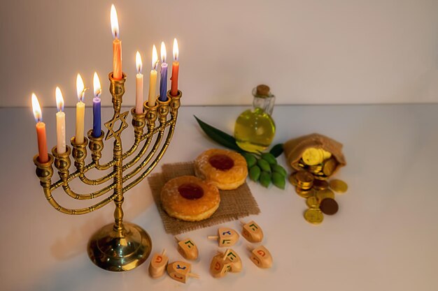 Candlestick holder with food and coins on table