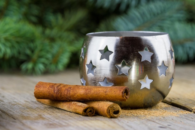 Candlestick with cinnamon sticks