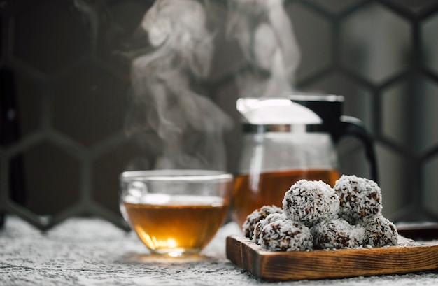 candy balls made of dates and coconut chips