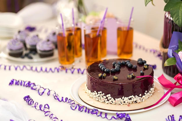 Candy bar decorated by delicious sweet buffet with cupcakes and other dessertscandieshappy birthday concept