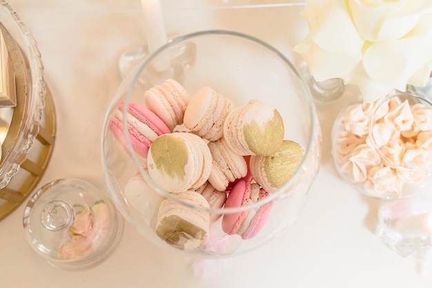 Candy bar and wedding cake. Table with sweets, buffet with cupcakes, candies, dessert.