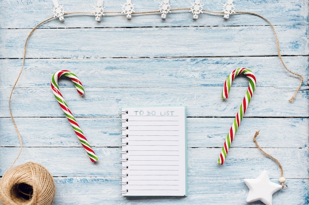 Candy cane and to do list on blue and white 