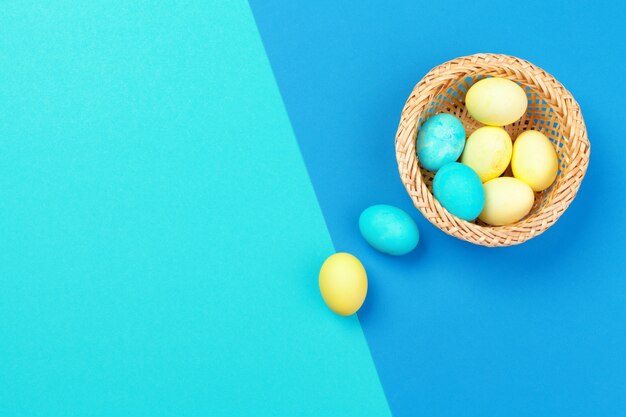 Candy color easter eggs over bright paper