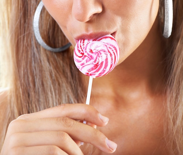 Candy girl Closeup shot of a woman sucking a lollipop