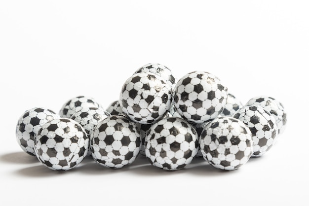 Candy shaped as football balls