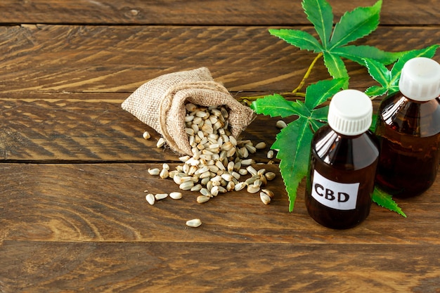 Cannabis CBD oil hemp products - capsules and seeds of hemp.