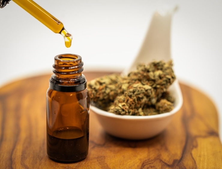 Photo cannabis cbd oil pipette on wood