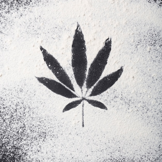 Cannabis food concept. Sprinkled flour on the table