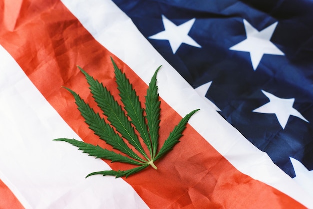 Cannabis or hemp leaf on the USA flag View from above Legalization of marijuana