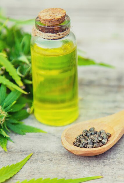 Cannabis oil in a small bottle. Selective focus.