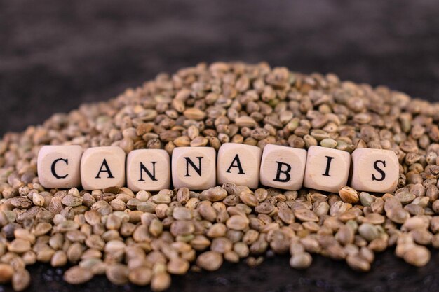 Cannabis seeds were spilling out of the jar. Close-up.