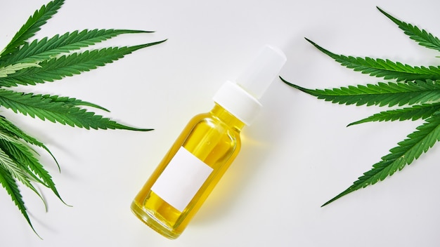 Cannabis with extract oil in a bottle