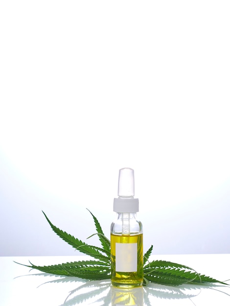 Cannabis with extract oil in a bottle