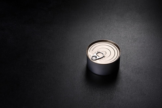 Canned delicious fresh tuna in oil with salt and spices in a tin can