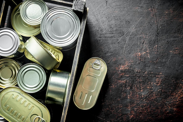 Photo canned food in closed cans in a box