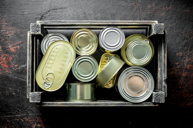 Canned food in closed cans in a box