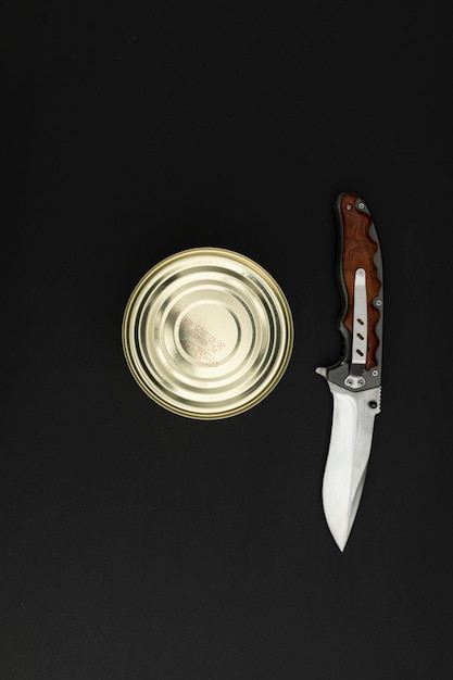 Canned food in a tin on a black background