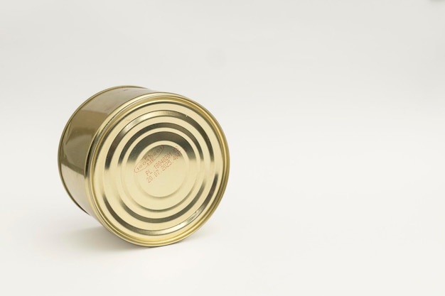 Photo canned food in a tin on a white background