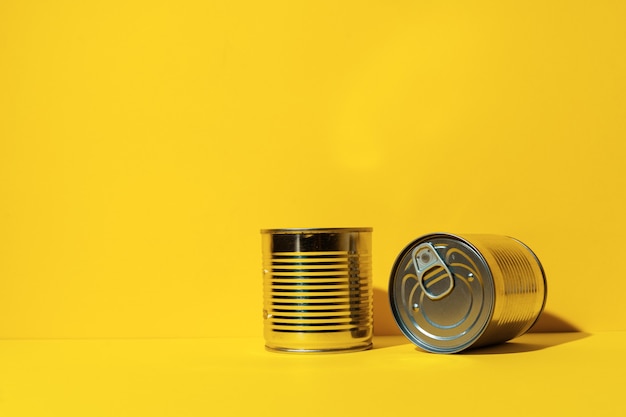 Canned food tin on yellow