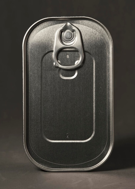 Photo canned food top view on a plain gray background