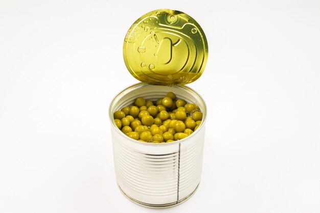 Canned food on white background. Green pea.