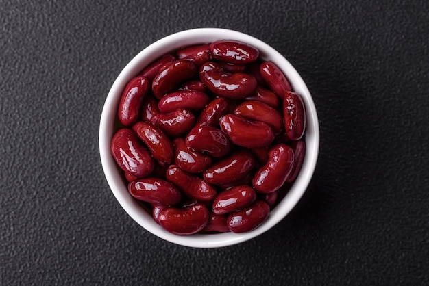 Canned red beans with salt and spices in a white bowl