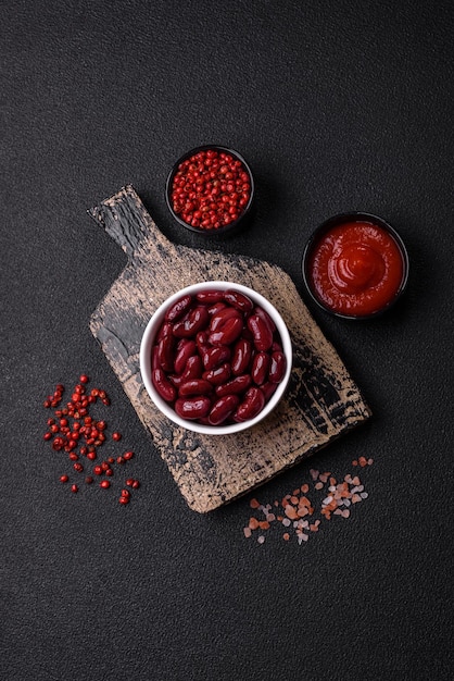 Canned red beans with salt and spices in a white bowl