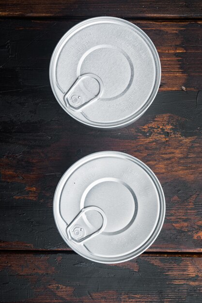 Canned sauce tin can, on old wooden table, top view or flat lay