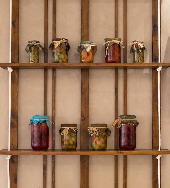 canned vegetables and fruits in glass jars