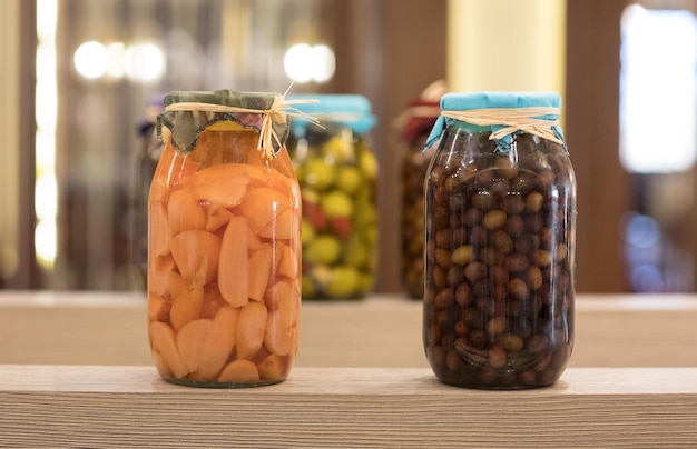 canned vegetables and fruits in glass jars