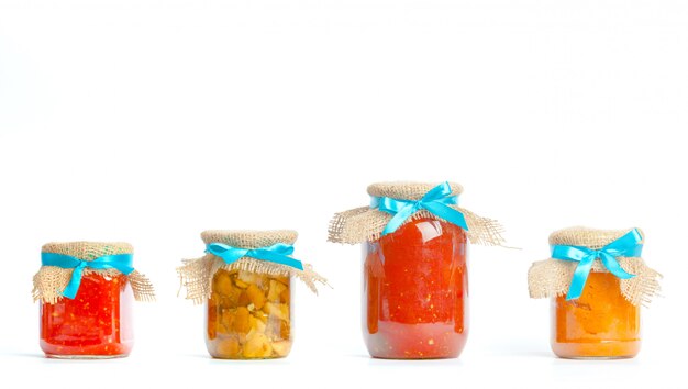 Canned vegetables in glass jars isolated 