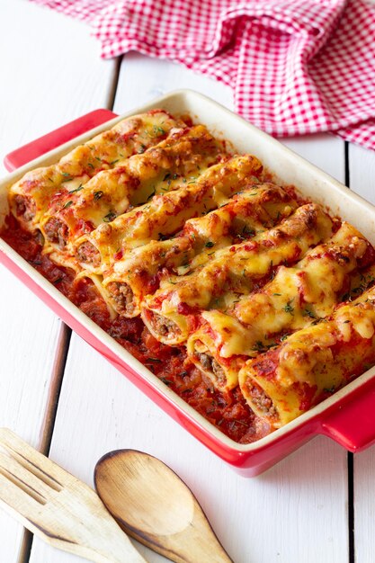 Cannelloni with meat cheese tomatoes and thyme Italian cuisine