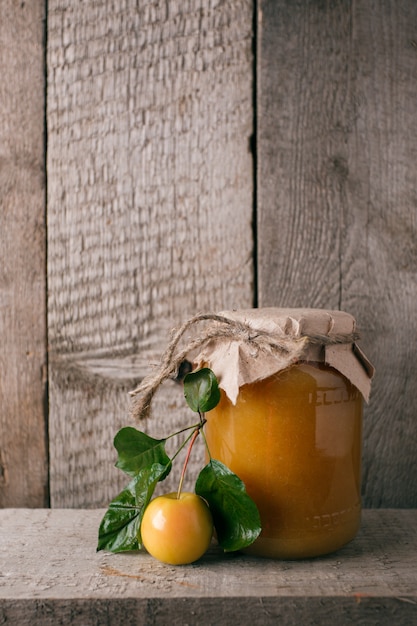 Canning at home, jar with apple jam.