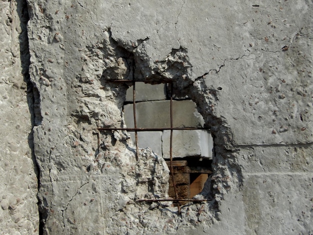 Cannon Shell In Broken Concrete Fence