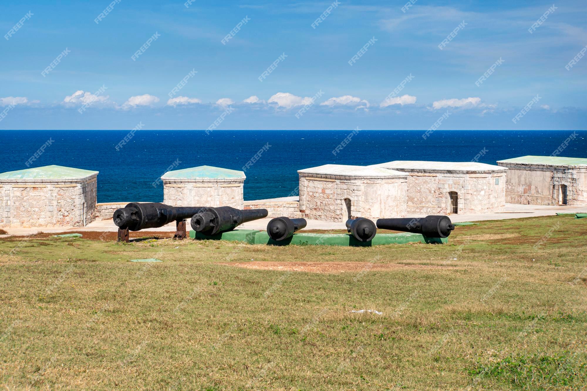 Cuba, Havana. Fortress wall and Cuban flag at San Carlos de