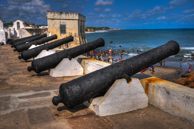 Cannons overlooking from Cape Coast Castle Cape Coast Castle is a fortification in Ghana built