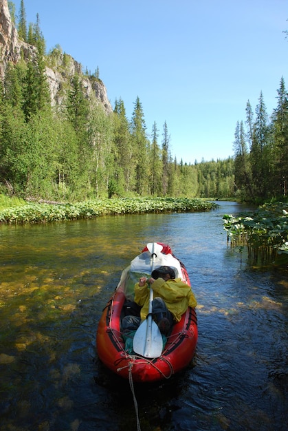 Canoe on the river in the virgin forests of Komi