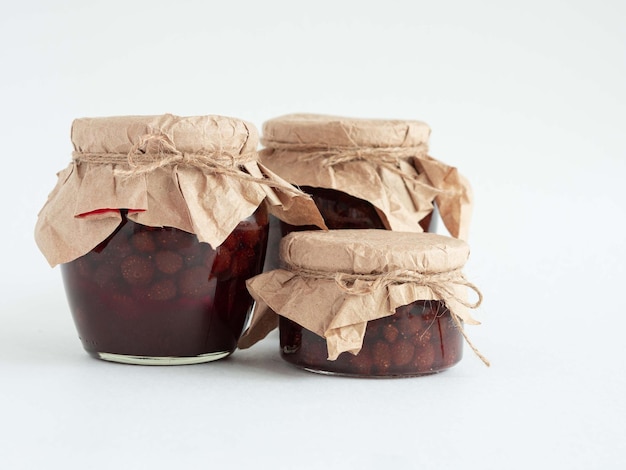 Cans of strawberry homemade jam Winter preserves